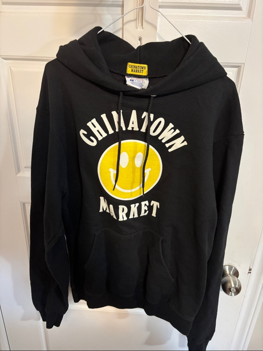 Champion Chinatown Market Black Hoodie with Yellow Smiley Graphic